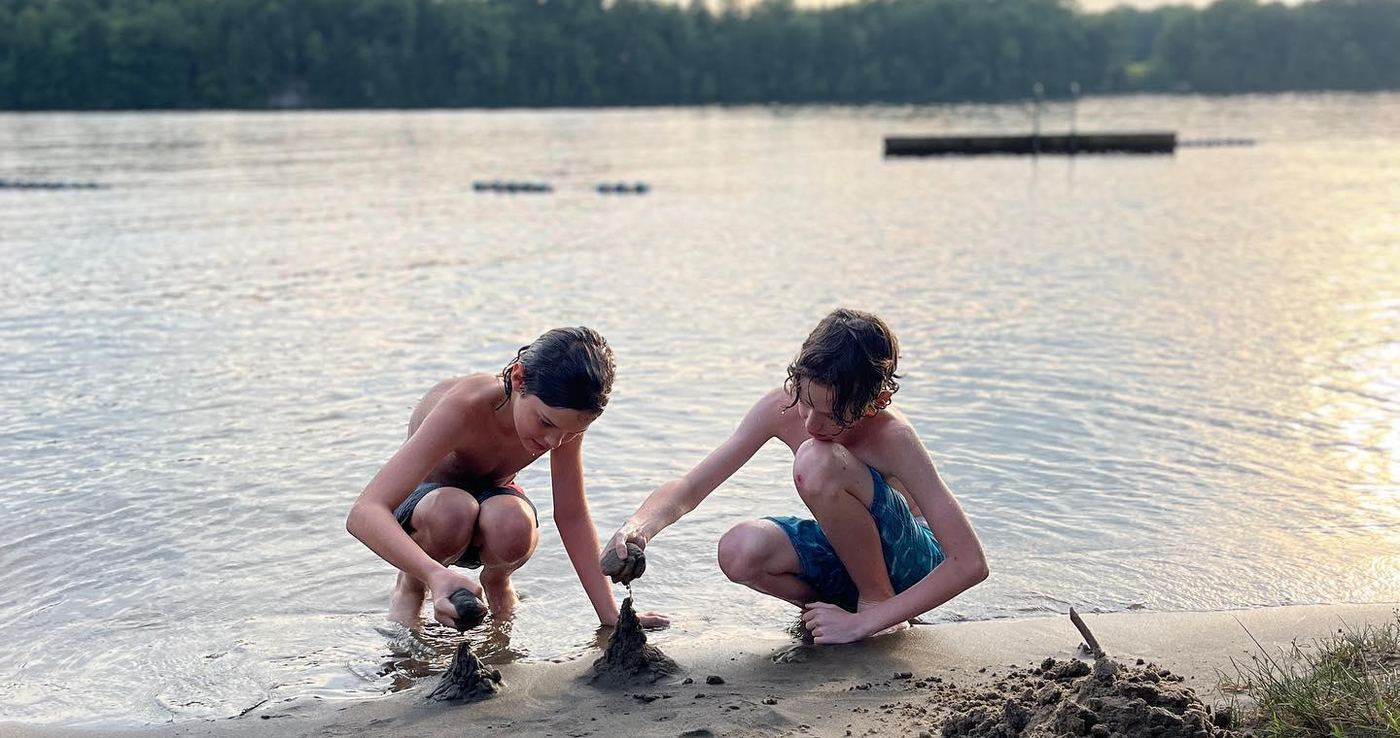 The boys at the Muskoka lake at golden hour